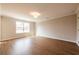 This bright bedroom features hardwood flooring, neutral paint and natural light at 125 Priestwood Ln, Acworth, GA 30102