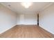 Spacious bedroom featuring wood-look floors, neutral walls, and a light fixture at 125 Priestwood Ln, Acworth, GA 30102
