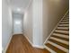The bright hallway features hardwood floors, white walls and staircase access at 125 Priestwood Ln, Acworth, GA 30102
