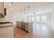 Kitchen featuring stainless steel appliances, wood flooring, granite countertops, island with bar seating at 125 Priestwood Ln, Acworth, GA 30102