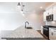 Kitchen featuring a large island, stainless steel appliances, granite countertops, pendant lighting at 125 Priestwood Ln, Acworth, GA 30102
