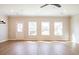 This spacious living room features hardwood flooring, neutral paint, and backyard views at 125 Priestwood Ln, Acworth, GA 30102