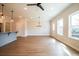 Spacious living room featuring hardwood flooring, neutral paint and modern light fixtures at 125 Priestwood Ln, Acworth, GA 30102