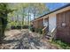Backyard with a basketball hoop, brick exterior and a stairway leading to the door at 1286 Calhoun Sw Ter, Atlanta, GA 30314