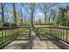Wooden deck overlooking a spacious, lush backyard with mature trees at 1286 Calhoun Sw Ter, Atlanta, GA 30314