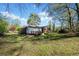 Expansive backyard with lush lawn and a deck perfect for outdoor entertaining at 1286 Calhoun Sw Ter, Atlanta, GA 30314