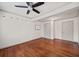 Bedroom with hardwood floors, ceiling fan, and multiple closets for ample storage at 1286 Calhoun Sw Ter, Atlanta, GA 30314