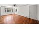 Bright living room with hardwood floors, ceiling fan and a large bay window at 1286 Calhoun Sw Ter, Atlanta, GA 30314