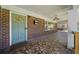 Covered front porch featuring mosaic tile flooring, a decorative light fixture, and a view of the yard at 1286 Calhoun Sw Ter, Atlanta, GA 30314