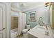 Well-lit bathroom features a shower-tub combo, framed mirror, and sleek fixtures at 1820 Buckhead Valley Ne Ln, Atlanta, GA 30324