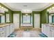 Large bathroom with soaking tub, double vanities, tile floors, and a serene ambiance at 1820 Buckhead Valley Ne Ln, Atlanta, GA 30324