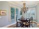 Cozy breakfast nook with chandelier and plantation shutters offering lots of natural light at 1820 Buckhead Valley Ne Ln, Atlanta, GA 30324