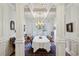 Formal dining room with elegant trim, white coffered ceiling, and chandelier over a large table at 1820 Buckhead Valley Ne Ln, Atlanta, GA 30324