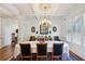 Formal dining room with coffered ceiling, chandelier, and seating for eight, ideal for hosting dinner parties at 1820 Buckhead Valley Ne Ln, Atlanta, GA 30324
