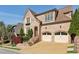 Charming brick home with a two-car garage, manicured landscaping, and inviting curb appeal at 1820 Buckhead Valley Ne Ln, Atlanta, GA 30324