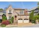 Charming brick home with a two-car garage, manicured landscaping, and inviting curb appeal at 1820 Buckhead Valley Ne Ln, Atlanta, GA 30324