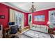Bright home office with red walls, hardwood floors, sofa, desk and windows with plantation shutters at 1820 Buckhead Valley Ne Ln, Atlanta, GA 30324