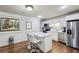 Charming kitchen with stainless steel appliances, white cabinets, and a marble island at 1820 Buckhead Valley Ne Ln, Atlanta, GA 30324