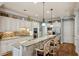 Bright kitchen featuring granite countertops, a tile backsplash, a large island, and stainless steel appliances at 1820 Buckhead Valley Ne Ln, Atlanta, GA 30324