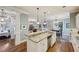 Open kitchen with granite countertops, breakfast bar, and seamless flow to dining and living areas at 1820 Buckhead Valley Ne Ln, Atlanta, GA 30324