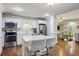 Modern kitchen features stainless appliances, granite counters, island with seating, and white cabinetry at 1820 Buckhead Valley Ne Ln, Atlanta, GA 30324