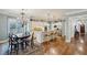 Spacious kitchen with white cabinetry, granite counters, stainless appliances, and an island with seating at 1820 Buckhead Valley Ne Ln, Atlanta, GA 30324