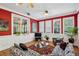 Inviting living room featuring wainscoting, large windows, hardwood floors, and comfortable seating at 1820 Buckhead Valley Ne Ln, Atlanta, GA 30324
