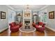 Cozy living room with a fireplace, hardwood floors, and stylish furniture arrangement at 1820 Buckhead Valley Ne Ln, Atlanta, GA 30324