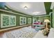 Expansive main bedroom with a sitting area, hardwood floors, and large windows at 1820 Buckhead Valley Ne Ln, Atlanta, GA 30324