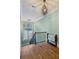 Stairway with hardwood steps, iron railing, and a window providing natural light at 1820 Buckhead Valley Ne Ln, Atlanta, GA 30324