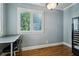 Bright study with large window, custom desk and cabinetry, ideal for working from home at 1820 Buckhead Valley Ne Ln, Atlanta, GA 30324