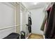Bright walk-in closet with custom shelving and rod space for neatly storing clothing and accessories at 1820 Buckhead Valley Ne Ln, Atlanta, GA 30324
