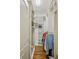 Bright walk-in closet features custom shelving, hanging rods, and hardwood flooring at 1820 Buckhead Valley Ne Ln, Atlanta, GA 30324