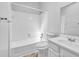 Bathroom featuring tiled tub with shower, white toilet, and vanity with sink at 2143 Victoria Pl, Lithonia, GA 30058
