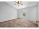 Cozy bedroom features neutral carpet, and natural light at 2143 Victoria Pl, Lithonia, GA 30058