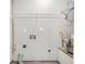 Laundry room with white walls, wire shelving, and connections for laundry machines at 2143 Victoria Pl, Lithonia, GA 30058