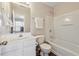 Bright bathroom with modern fixtures, ample lighting, and a combination tub/shower at 3182 Mill Springs Cir, Buford, GA 30519