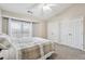Tranquil bedroom features plush carpet, natural light, a full sized closet and vaulted ceilings at 3182 Mill Springs Cir, Buford, GA 30519