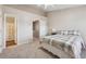 Neutral bedroom featuring a ceiling fan, and doorway leading to the bathroom at 3182 Mill Springs Cir, Buford, GA 30519