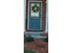 Close-up of the blue front door adorned with a seasonal wreath and house number at 3182 Mill Springs Cir, Buford, GA 30519