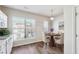 Bright kitchen nook area with wood-look flooring and round dining table and 4 chairs at 3182 Mill Springs Cir, Buford, GA 30519