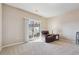 Bright living room with a sliding glass door leading to the outside at 3182 Mill Springs Cir, Buford, GA 30519