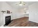 Hardwood floor living area featuring fireplace, ceiling fan, and open floor plan at 3182 Mill Springs Cir, Buford, GA 30519