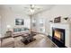 Tastefully decorated living room with a fireplace, sofa, and modern decor at 3182 Mill Springs Cir, Buford, GA 30519