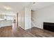 Living space with hardwood floors, neutral walls, and an open kitchen concept at 3182 Mill Springs Cir, Buford, GA 30519