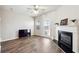 Spacious living room with fireplace, ceiling fan, and access to the backyard at 3182 Mill Springs Cir, Buford, GA 30519