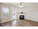 Sunlit living room with hardwood floors, a fireplace, and backyard access at 3182 Mill Springs Cir, Buford, GA 30519