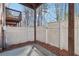 View of a fenced-in patio with brick wall, adjacent to the home at 3182 Mill Springs Cir, Buford, GA 30519