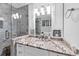 Elegant bathroom featuring marble countertops and a glass-enclosed shower, a modern and spa-like design at 980 Pine Grove Pointe Dr, Roswell, GA 30075