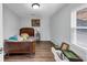Cozy bedroom with hardwood floors and natural light from the window at 980 Pine Grove Pointe Dr, Roswell, GA 30075